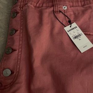 Pink paper bag waisted shorts.